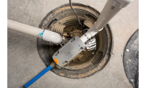 How to Conceal The Sump Pump Discharge Pipe